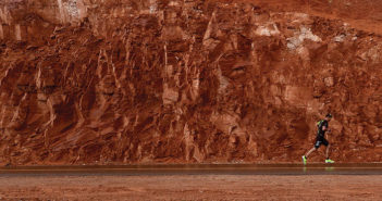 Runner against a red rock background