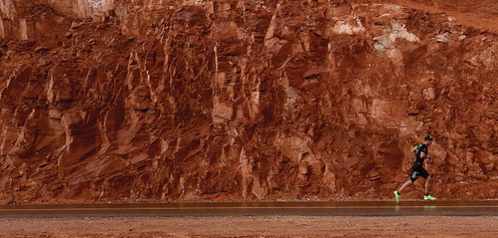 Runner against a red rock background