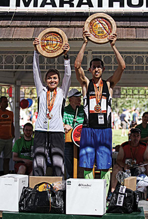 St. George Marathon winners Amber Green and Aaron Metler hold their trophies
