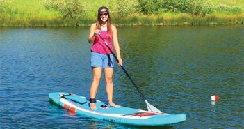 Editor Jenny Willden paddle boarding on a lake