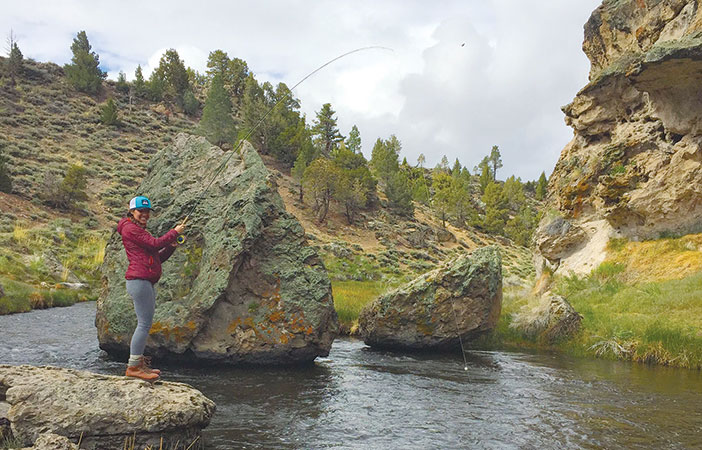 Jenny Willden Reeling in a trout at Mammoth's Hot Creek.