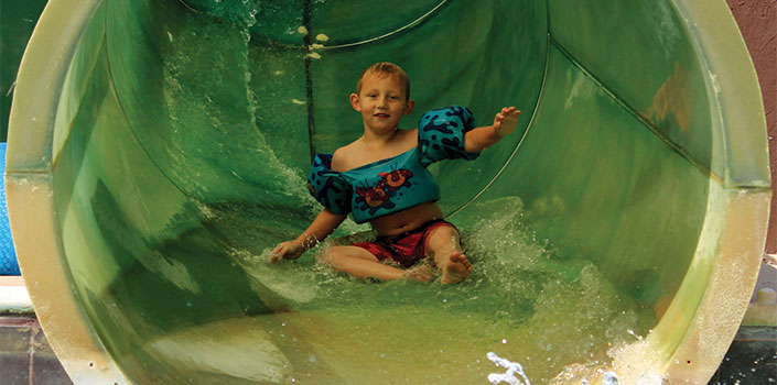 Child on hot springs water slide