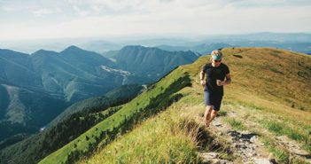 Man running on a mountain trail