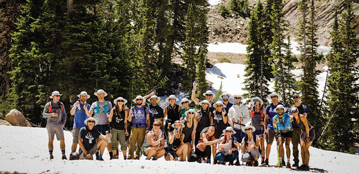 group of adult campers hiking at Snowbasin